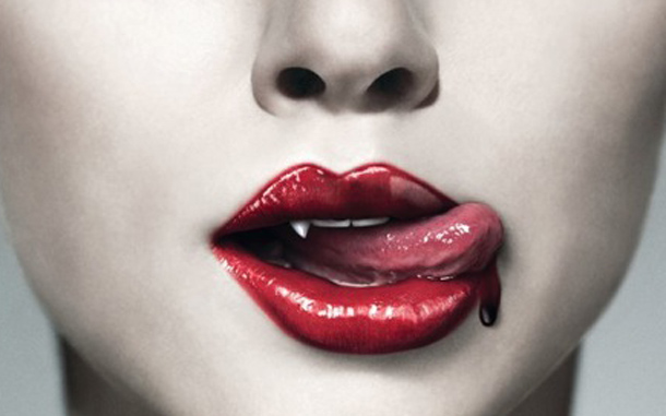 Vampire fetish, blood dripping from red vampire lips